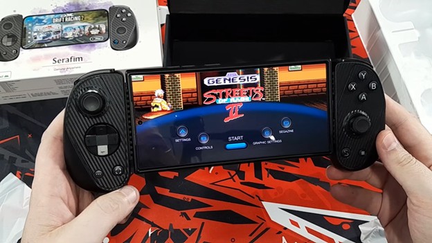 Serafim S3 mobile controller attached to a tablet running a retro-style game interface