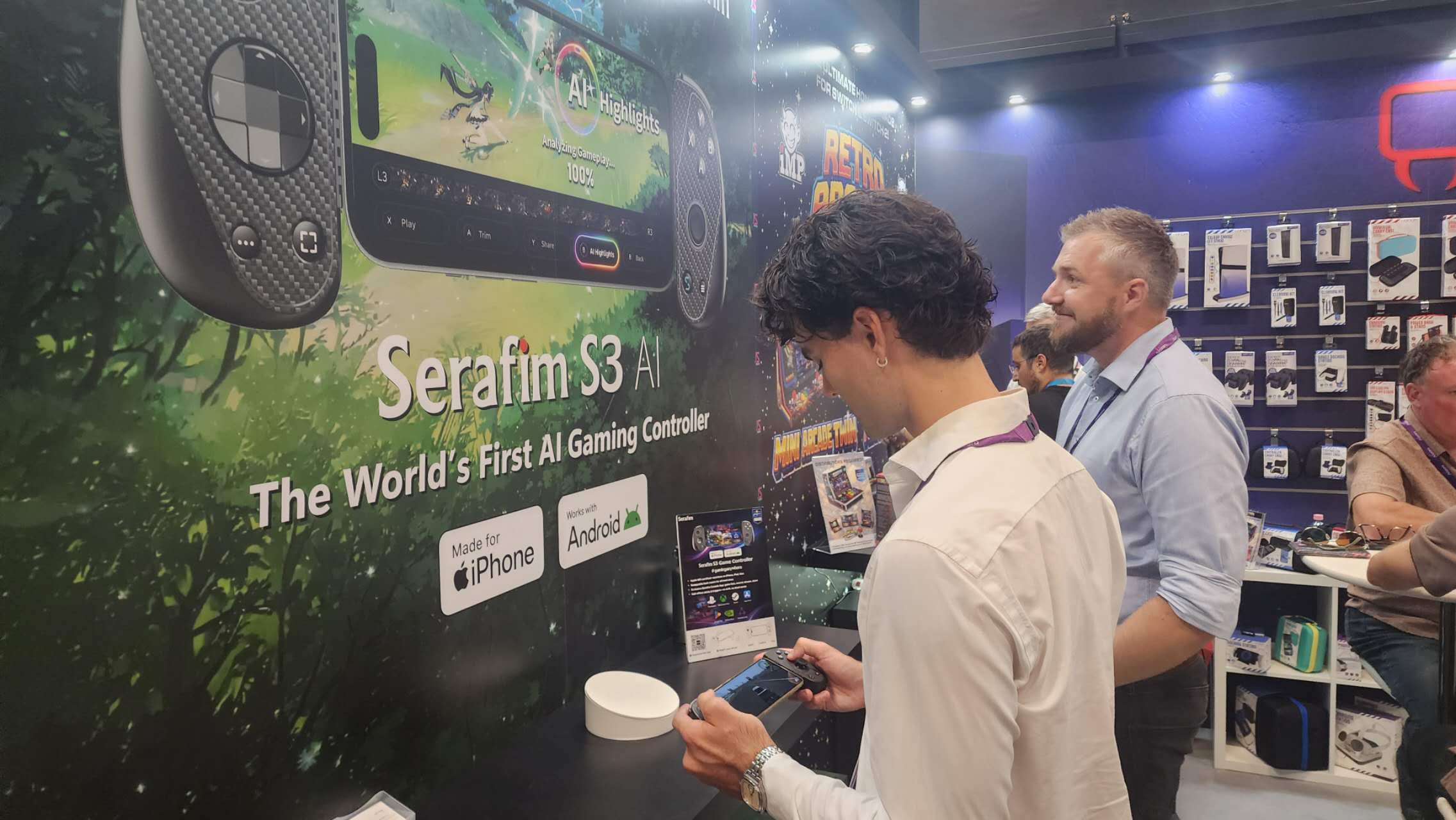 Attendee trying the Serafim S3 mobile gaming controller at the Serafim booth during Gamescom 2026 in Cologne.
